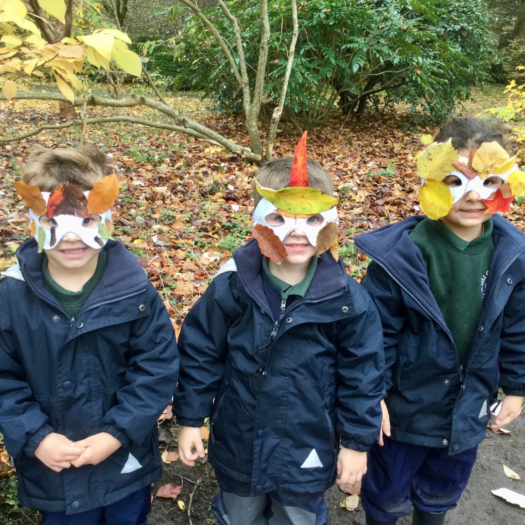 Children with face masks they have made outside