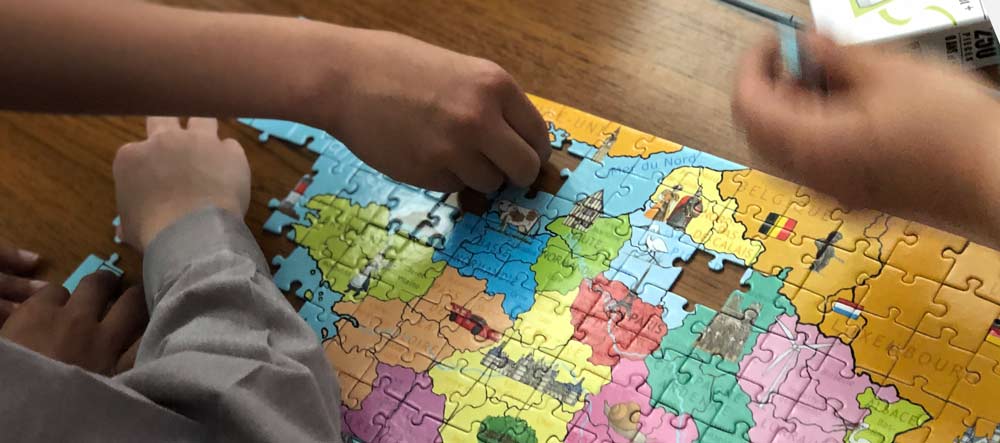 Boys doing a puzzle