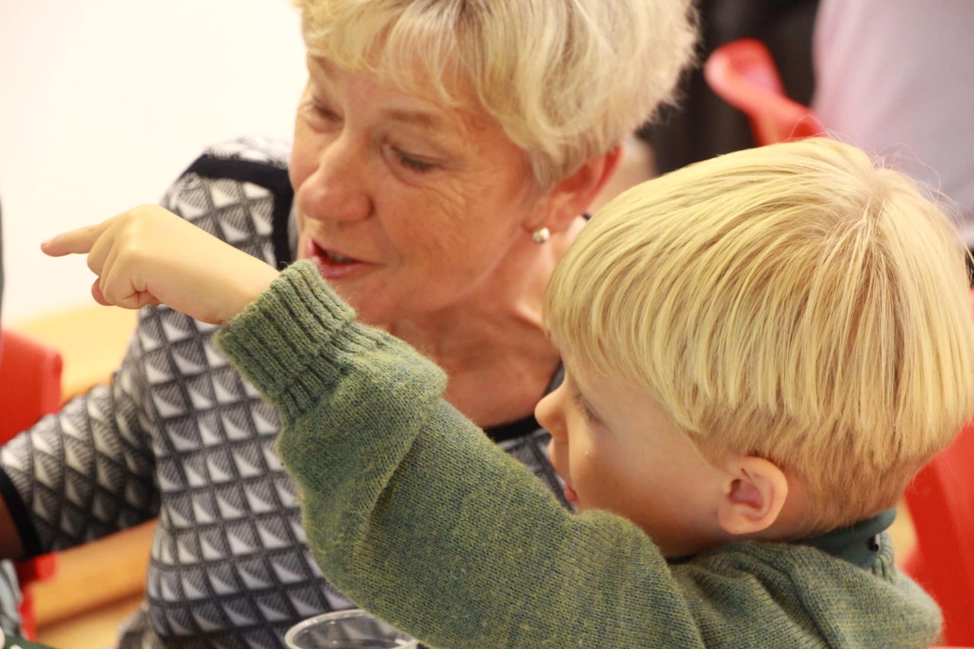 Boy with grandparent in discussion