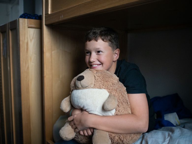 Boy with oversized teddy bear