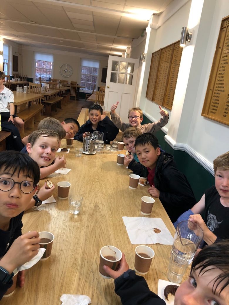 Boys in Dining Hall with hot chocolate